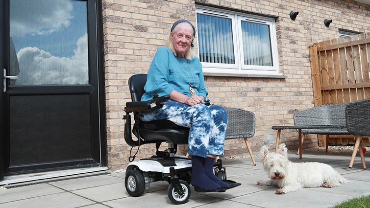 This image shows a resident of the new tech-enabled homes that have been built as part of the Blantyre Care Hub