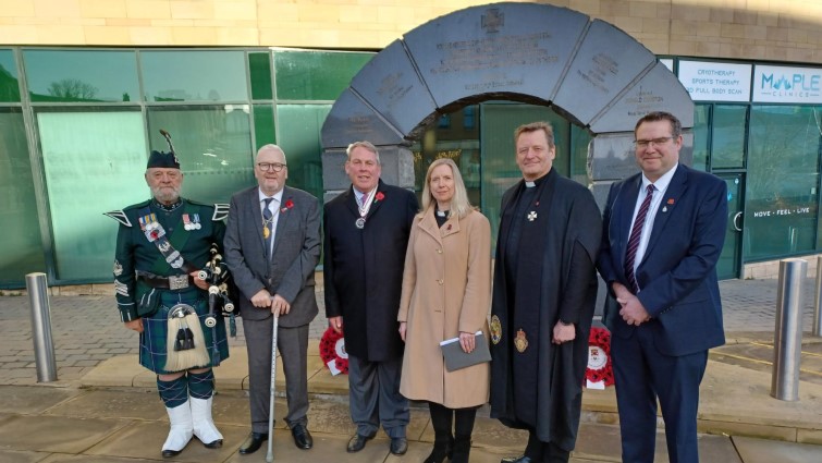 This image shows Depute Provost Bert Thompson and other invited guests following the Armistice Day 2024 service at the Victoria Cross Memorial in Hamilton