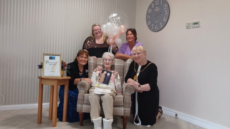 Betty Neil with two members of staff from Whitehills Care Home, Provost Margaret Cooper and Deputy Lieutenant Alison Plummer