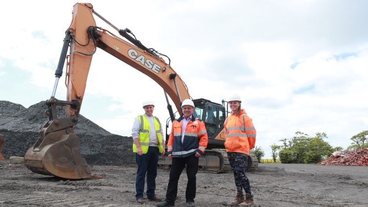 Carly, Danny Sneddon and Tommy Campbell are standing together at the site of the Raeburn Brick quarry in Blantyre.