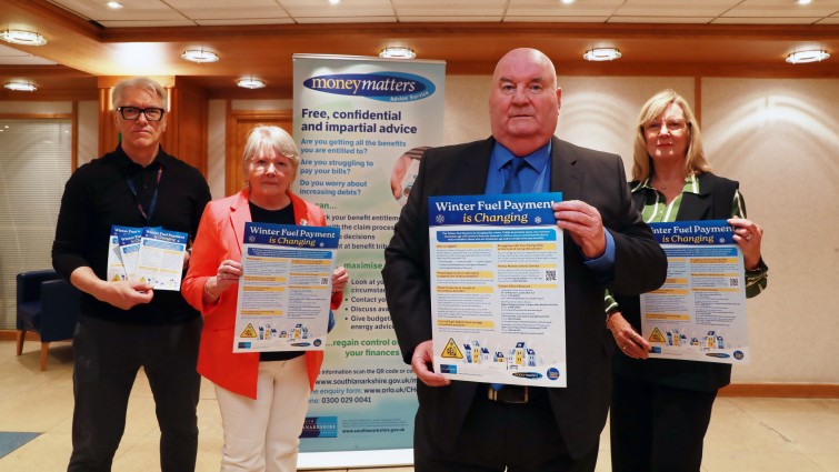 This image shows Councillor Gerry Convery with SLC staff and the chair of Seniors Together at the launch of new campaign to help ensure older people continue to receive a Winter Fuel Payment if they are entitled to it