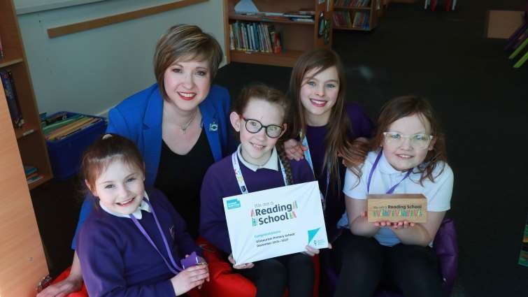 Gilmourton Primary School Head Teacher Louise Crawshaw and pupils celebrating being accreditation as a Reading School