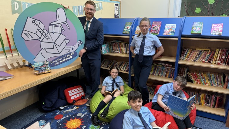 pupils in school library supported by donation from Browns Books