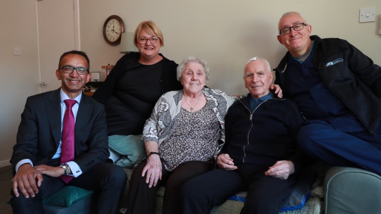 This image shows a couple who have been receiving support from the home care service, with two home carers and Professor Soumen Sengupta