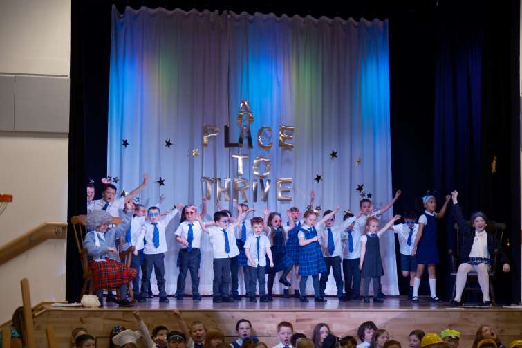 This image shows pupils from Jackton PS on stage at the performance during the official opening of the school