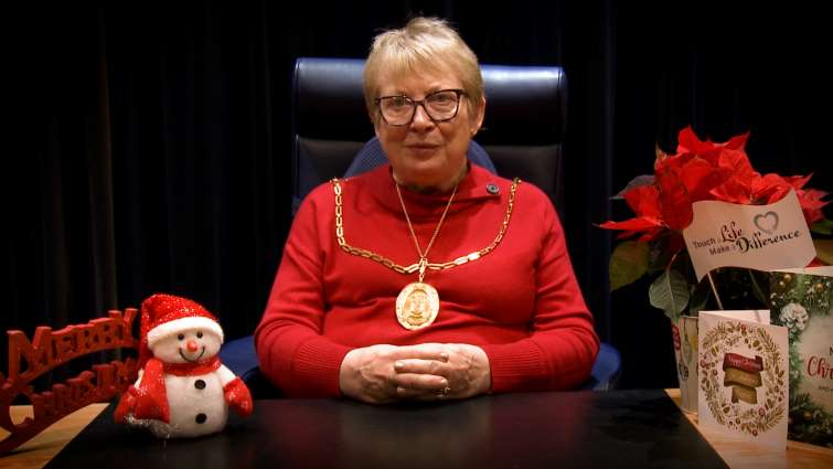 This image shows Provost Margaret Cooper reading her annual Christmas message