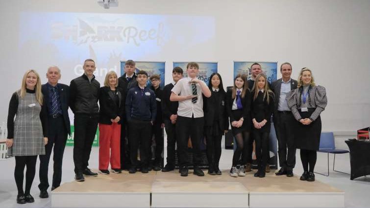 This image shows the winning teams and invited guests at the Shark Reef 2024 event