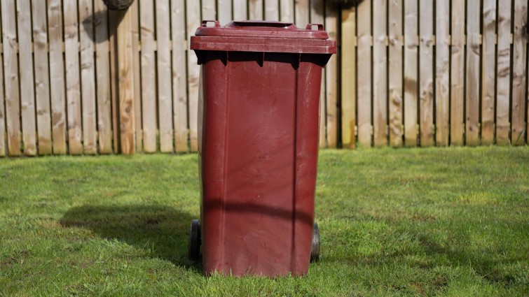 This is an image of a burgundy bin used for garden and food waste in South Lanarkshire
