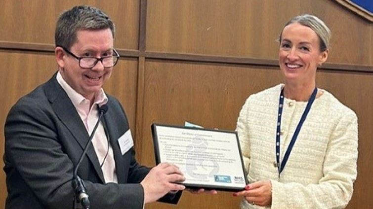 SLC Chief Executive Paul Manning receives the certificate of accreditation from the Breastfeeding Friendly Scheme