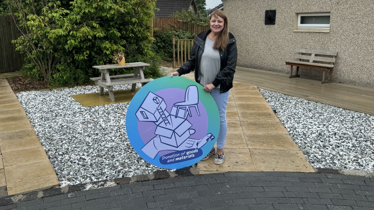 The Community Wish List graphic is displayed within the renovated garden of St John's Primary School, Blackwood.