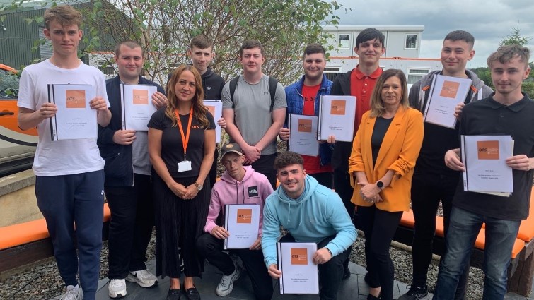 Young people with their certificates after completing a Skills Academy course.